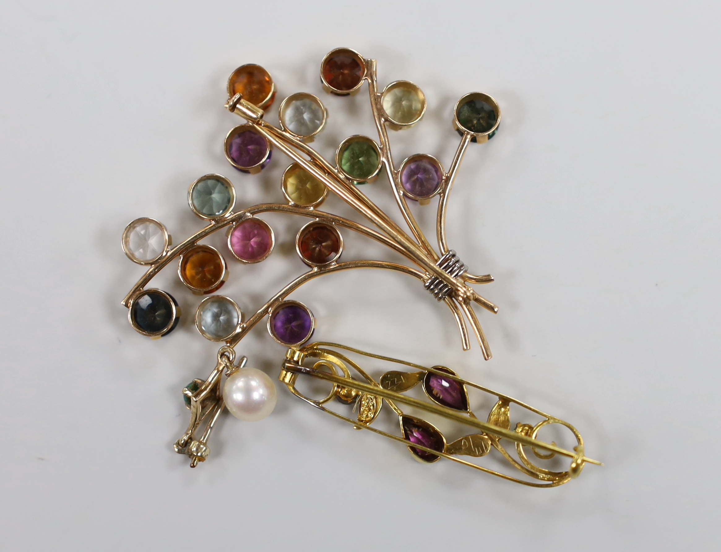 A 9ct seed pearl and gem set oval brooch, 35mm, one other yellow metal and multi gem set spray brooch and an odd drop earring, gross weight 10 grams.